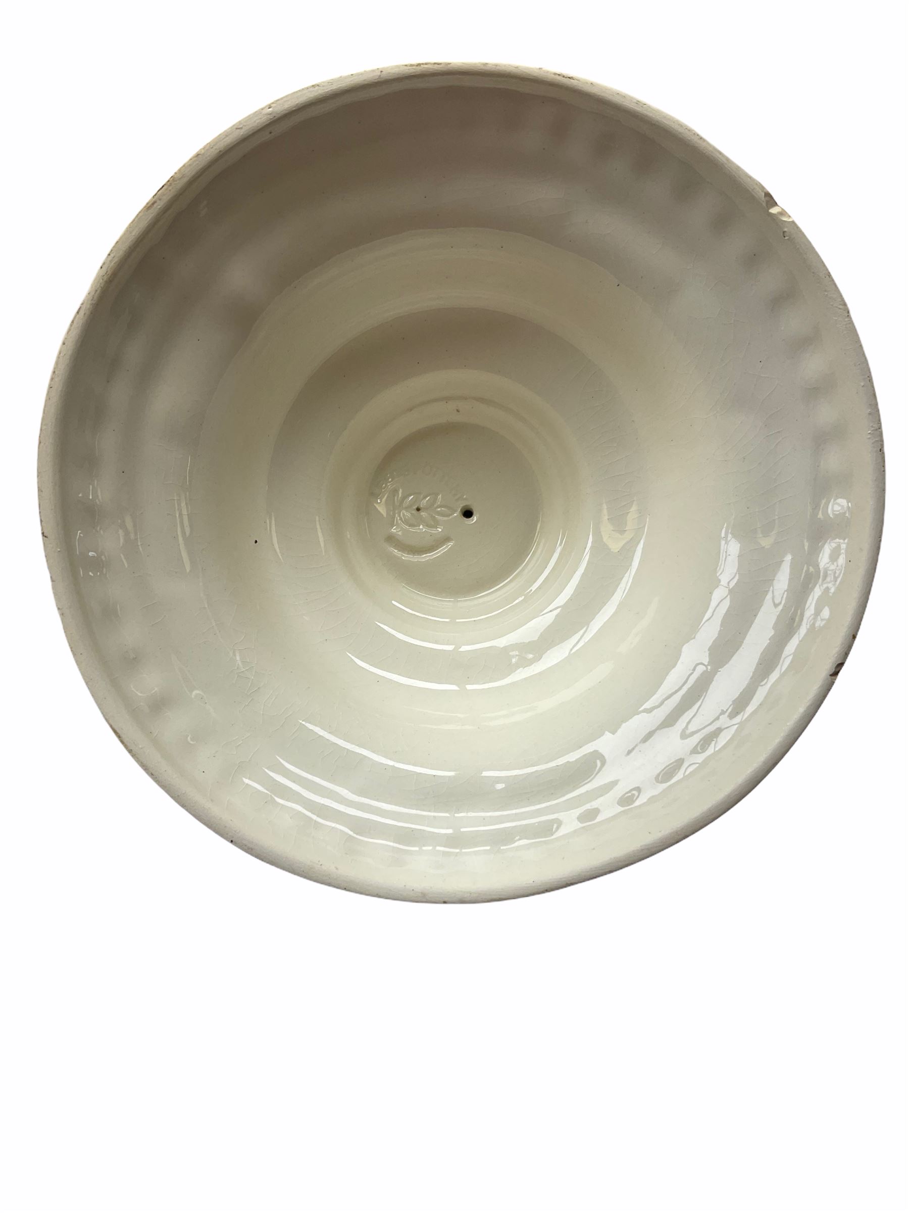 20th century Leeds creamware, comprising chestnut basket and stand, small tureen and cover, ladle, and associated stand, candlestick with stem modelled as a dolphin, teapot, tureen and cover in the form of a melon with fixed stand, and toast rack (toast rack a/f), each with impressed mark beneath. 