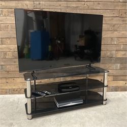 Samsung UE55BU8000K smart TV with accessories and stand  