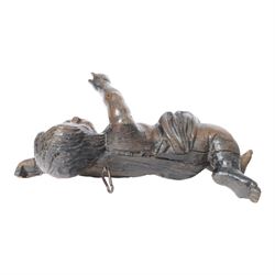 17th century carved figure of a putto, modelled with arms upstretched and head turned, approximately H64cm W23cm D27cm