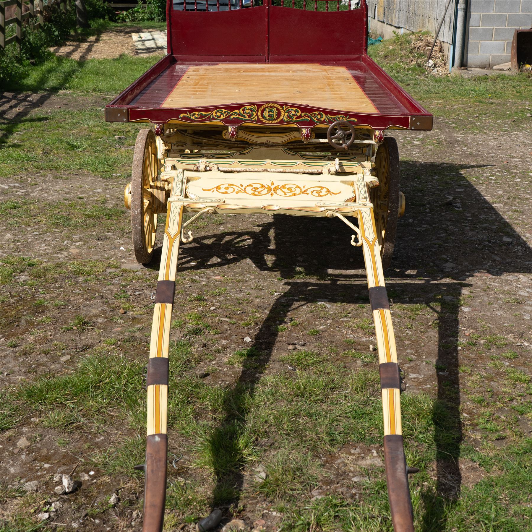 Advertising Trade Dray Wagon for C. Herring & Son, Hartlepool, Dated 1895 and Renovated 1975

An exceptionally decorative late Victorian horse drawn advertising trade dray, built by J. Herring of Hartlepool in 1895 and later renovated by C. Herring in 1975, as recorded by the painted inscription beneath the body. Finished in a striking cream and maroon livery with extensive hand painted signwriting, the wagon carries the name C. Herring & Son, Iron & Steel Processors, Hartlepool along its sides and rear panels. The wagon is fitted with a flat timber loading bed, twin shafts for a single horse, elegant spoked wooden wheels, iron bound tyres, rear headboard and traditional undercarriage with leaf spring suspension. Richly detailed scrollwork and lining throughout make this a particularly attractive example, suitable for collection, display, museum, promotional or coaching purposes.

Features

• Built by J. Herring, Hartlepool, 1895
• Renovated by C. Herring in 1975
• Original style hand painted advertising signwriting
• Flat timber loading platform
• Raised rear headboard with decorative pierced gallery
• Twin shafts for a single horse
• Wooden spoked wheels with iron tyres
• Traditional leaf spring suspension
• Extensive decorative lining and scrollwork throughout
• Attractive cream and maroon colour scheme
• Suitable for private collection, museum or display use

Dimensions:
Overall length: 560 cm
Body length: 300 cm
Width: 158 cm
Height: 150 cm

Wheel Diameters:
Front wheels: 76 cm
Rear wheels: 86 cm