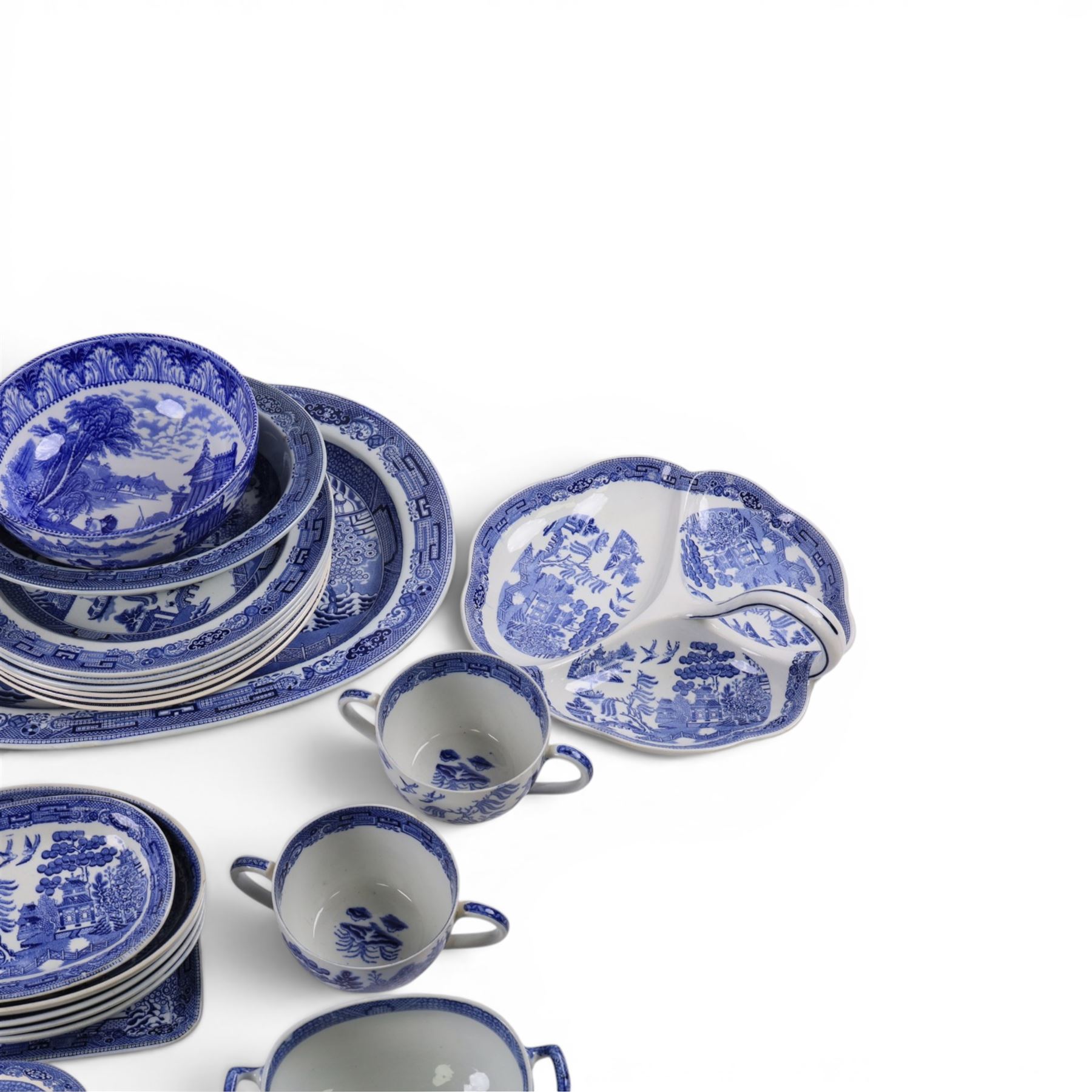Collection of blue and white dinner wares, mainly Wedgwood Willow pattern, including serving platter, dinner plates etc   