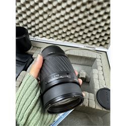 Yashica 230-AF camera outfit, including camera body serial no. 0184693, three Yashica lenses comprising AF 70-200mm 1:4.5 serial no. F6162003, AF 28-85mm 1:3.5-4.5 macro lens serial no. F6225564 and an AF 75-300mm 1:4-5.6 Macro lens serial no. F7100913, flash, hood and other accessories and instruction booklet, contained within a silver flight case 