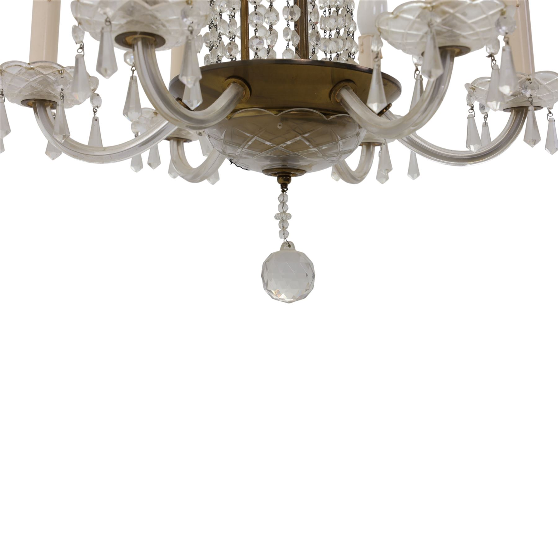Early 20th century Continental glass and brass six branch chandelier, the central baluster column hung with graduated faceted glass drops, issuing six scrolling glass arms each fitted with candle sconces and drip pans, suspended from a fluted glass canopy