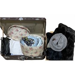 Quantity of clothing to include hats, coats, handbag etc and a brown suitcase