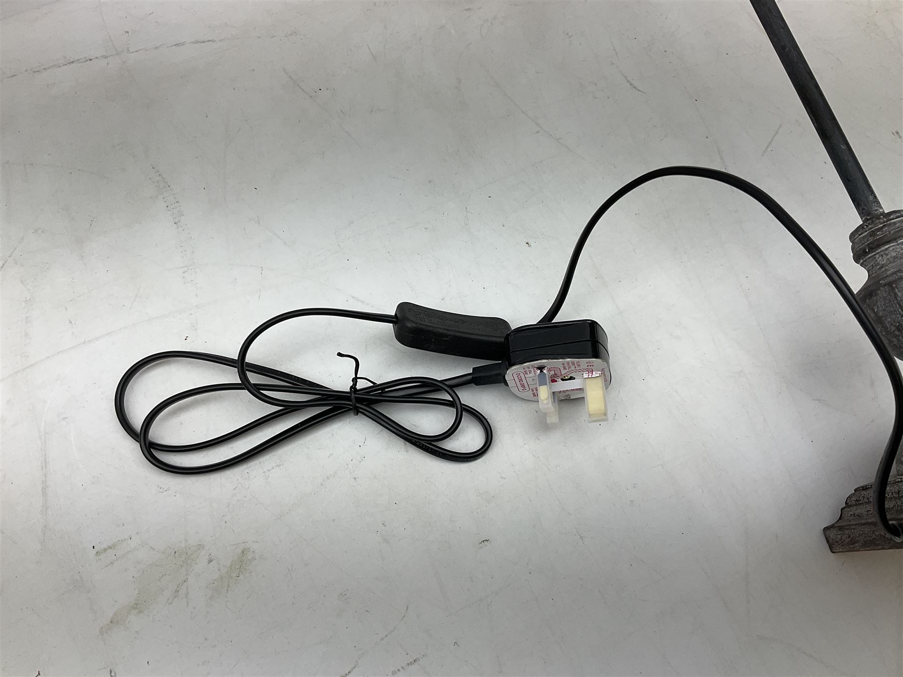 Table lamp, with a thin central stem upon a square stepped base, natural linen shade