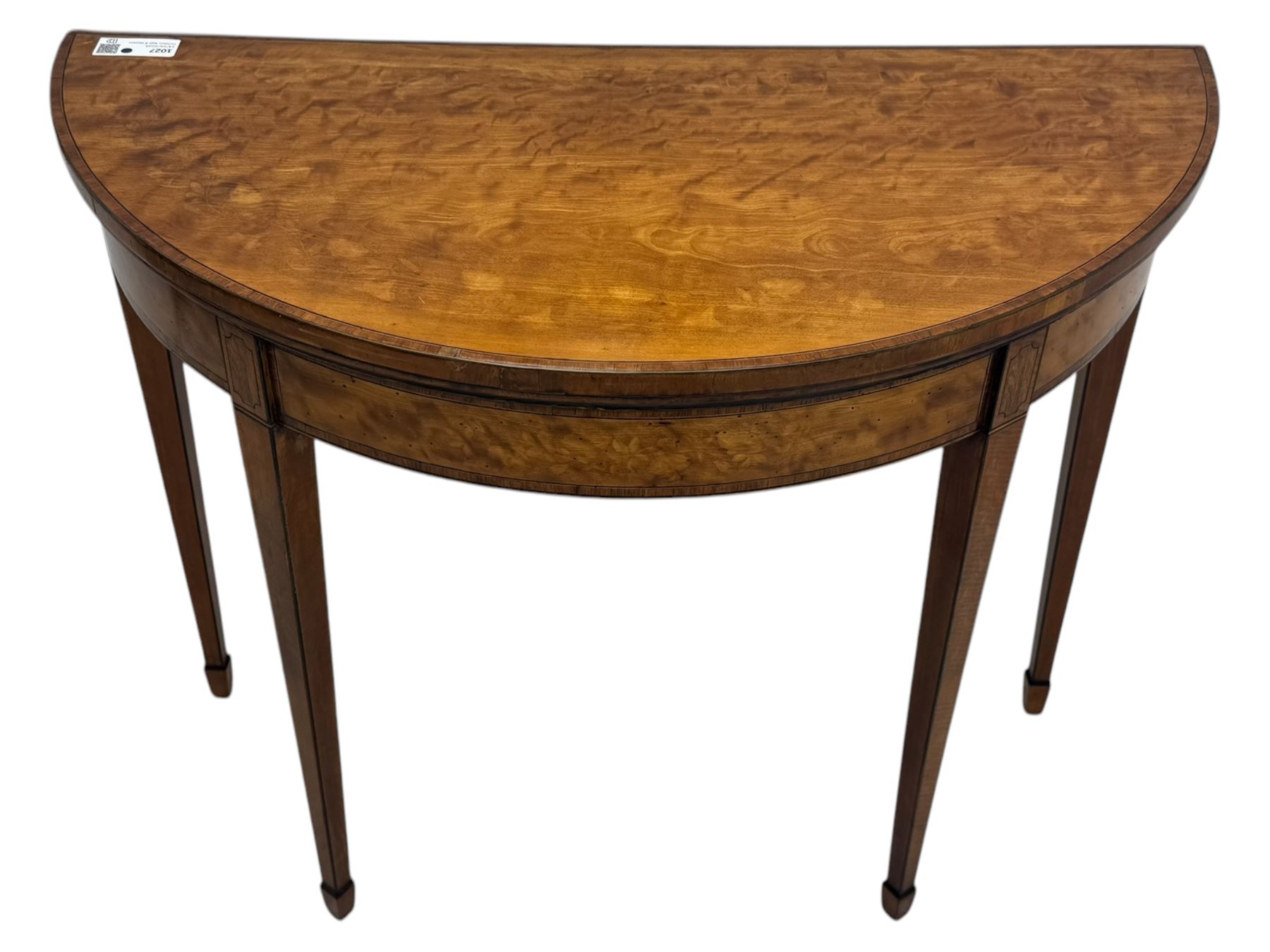 Edwardian satinwood inlaid demi-lune card table, hinged fold over green baize lined interior, raised on square tapered supports with spade feet  