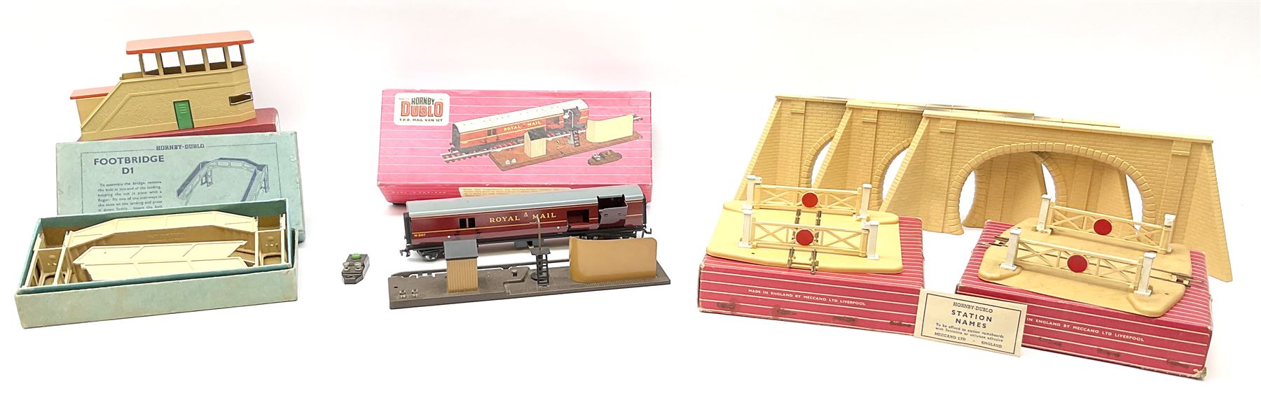 Hornby Dublo - 5080 Signal Cabin with pack of Station Names; two D1 Footbridges, one with instructions; and two 2460 Plastic Level Crossings suitable for two-rail system; 2400 T.P.O. Mail Van Set for two-rail system all boxed; together with three plastic brick effect tunnel mouths for double track layout (9)