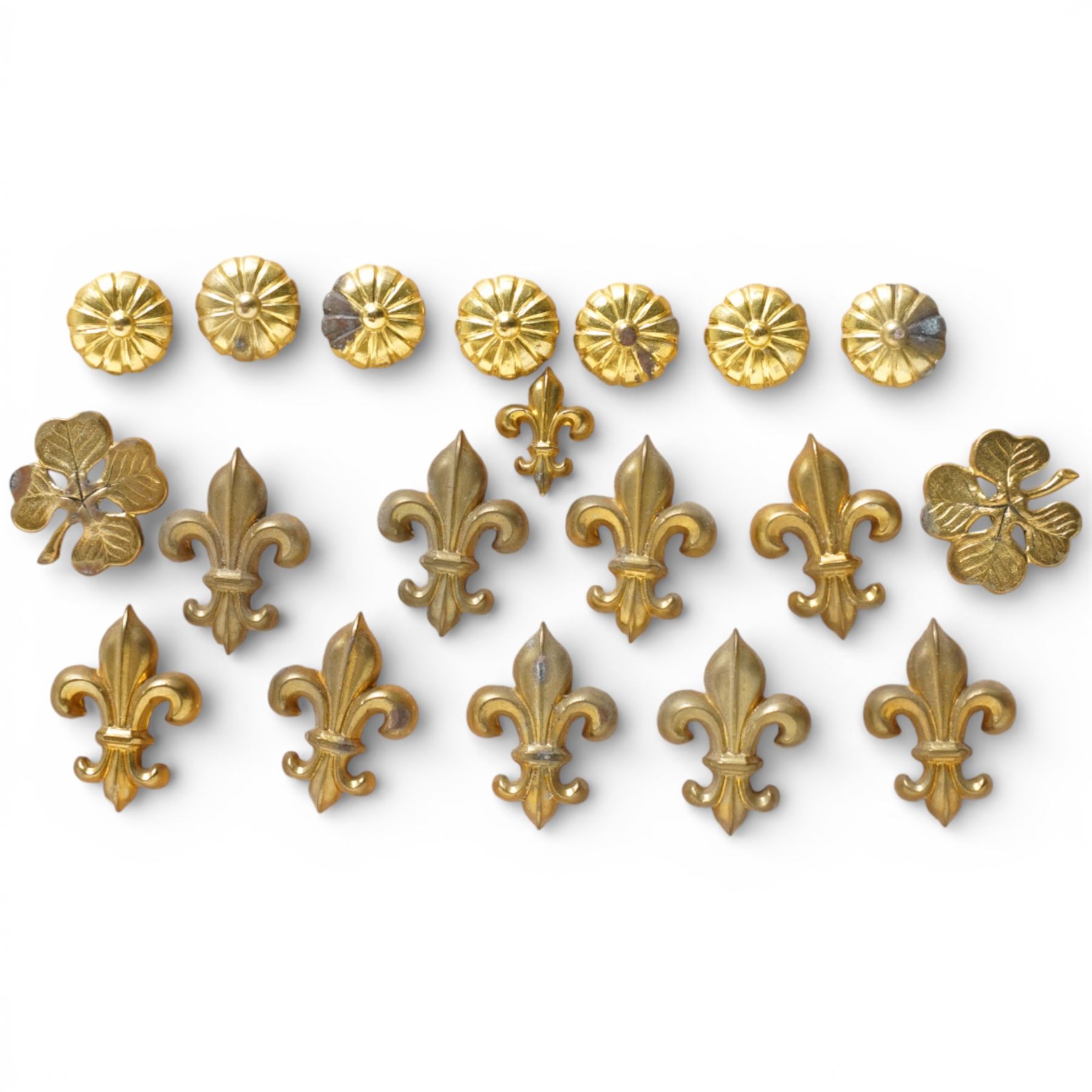 Large quantity of Victorian brass upholstery pins with rosette and fleur de lis designs 
Provenance: property of a Nobleman