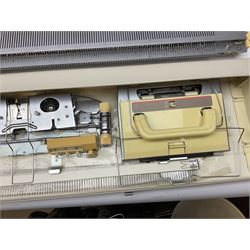  Brother cased knitting machine model KH-890 together with Brother Ribbing attachment model KH-850, knitting machine yarn cones in assorted colours, selection of knitting patterns etc
