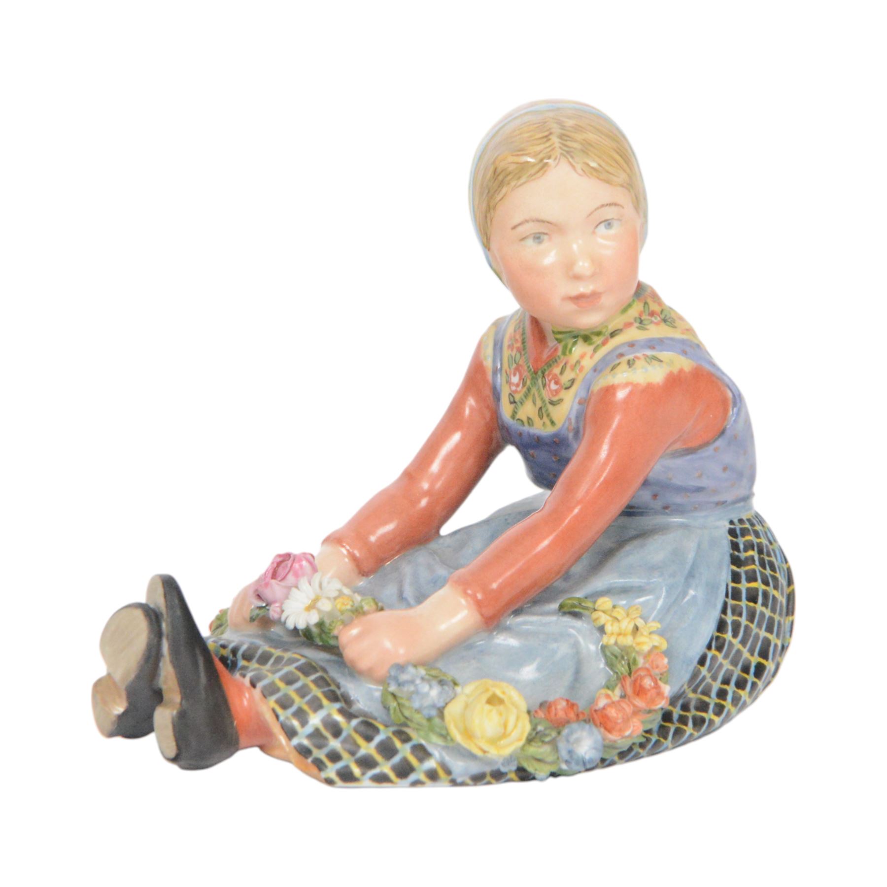 Royal Copenhagen figure, Jutland girl, designed by Carl Martin Hansen, from the Danish National Costumes series, of a girl with a flower garland, marked beneath, H8cm 