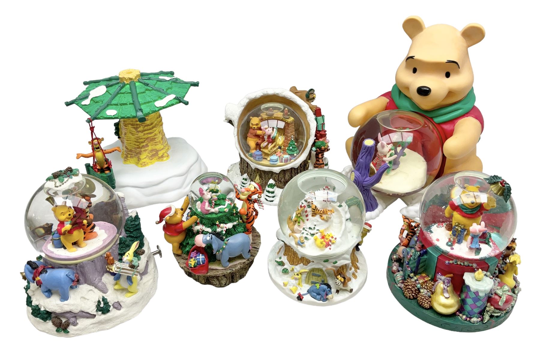 Six Disney Winnie the Pooh Christmas snow globes, comprising large Mr Christmas Holiday Snowfall, An Enchanted Christmas, It's A Small World Christmas 1994,  Tree Trimming, 1995 Christmas At Our House and Christmas Band Concert, together with Mr Christmas Holiday Go Round, all with boxes (7)