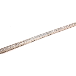  Platinum emerald cut diamond bracelet stamped 950, the flexible line of sixty-eight diamonds approx 6.3 carat  