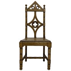 19th century Gothic elm chair, pointed cresting rail over shaped back with central quatrefoil roundel, on turned supports united by turned H-stretchers 