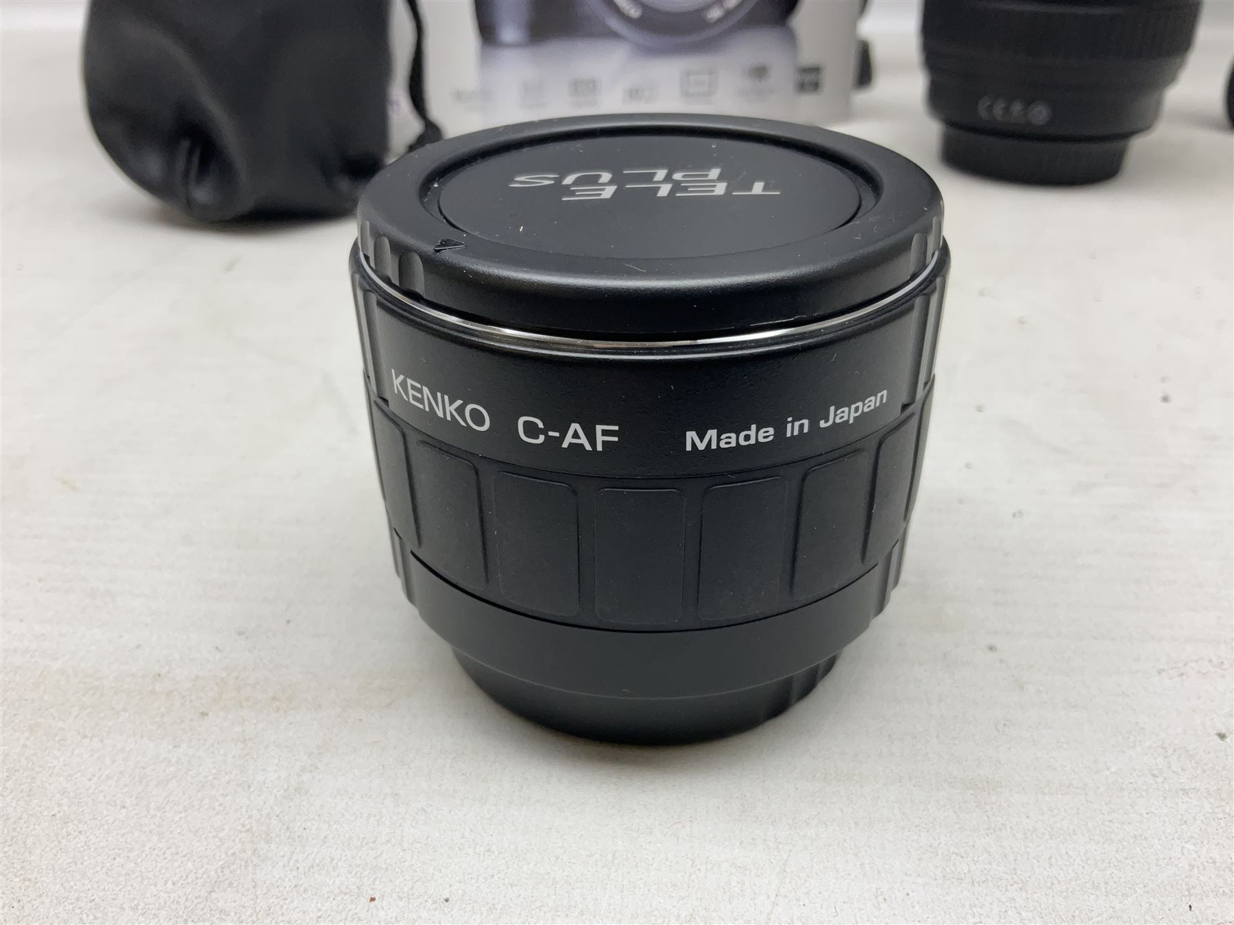 Canon Eos 7D camera body, serial number 3261306344, with 'Canon Ultrasonic EF 24-105mm Macro 0.45m/1.5ft Ultrasonic' Lens, 'Canon Zoom EF 75-300, 1;4-5.6 III' lens and Teleplus Pro 300 lens, together with tripod and original camera box 