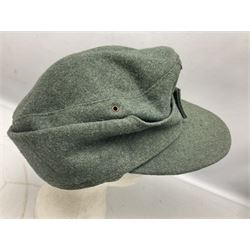 WW2 German Army M43 field cap with triangular cloth eagle and roundel badge and metal edelweiss badge for mountain troops; faintly stamped '5 VMF(?)'