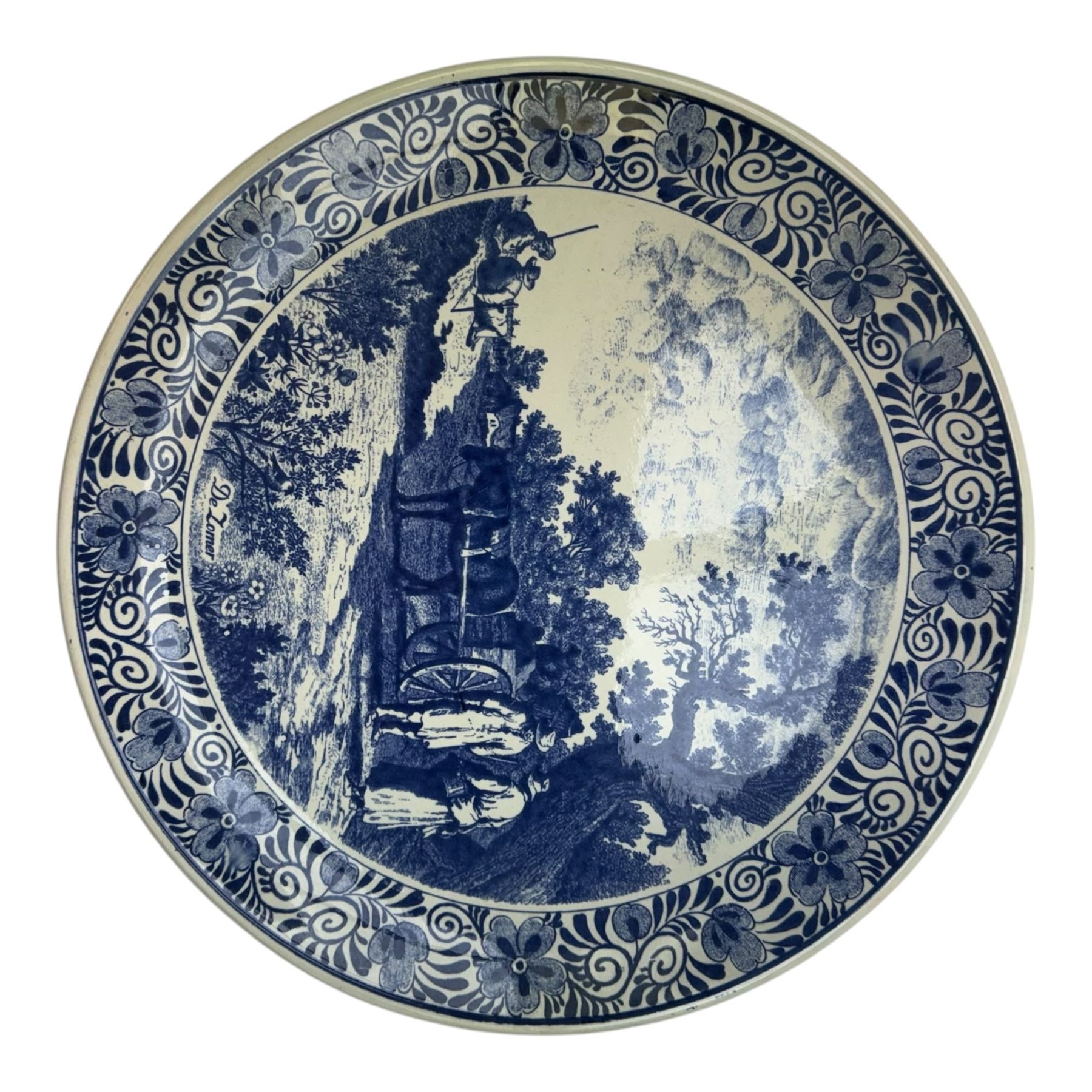 Ten Delft and similar chargers, including Delfts Blauw and Boch examples, largest D40cm