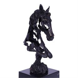 Stylised bronze model of an openwork horses head, signed Gadi and with foundry mark, raised upon black marble plinth, H41cm