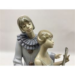 Lladro figure, Minstrel's Love, modelled as a couple entertaining, the lady in ballerina costume playing the lute and the gent stood behind her in jester type dress, sculpted by Rafael Lozano, with original box, no 5821, year issued 1991, year retired 1993, H31cm