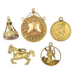 Victorian gold seal fob monogrammed GN, Birmingham 1887 and four other pendant/charms including horse and St Christopher, all 9ct