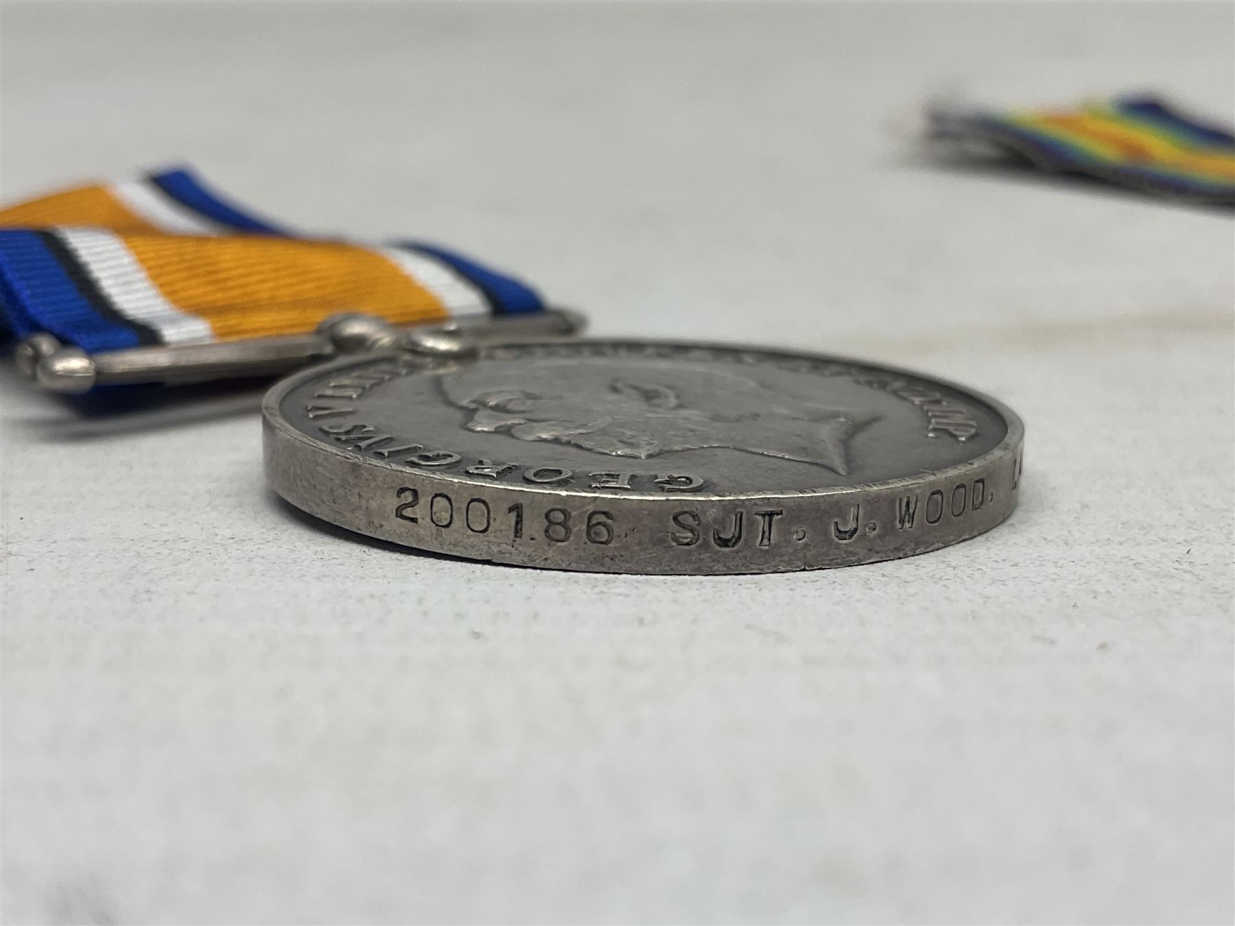WW1 pair of medals comprising British War Medal and 1914-15 Star awarded to 1440 Pte. J. Wood Lan. Fus.; and WW1 Victory Medal awarded to 12128 Bmbr. R. Phillips R.A.; all with ribbons (3)