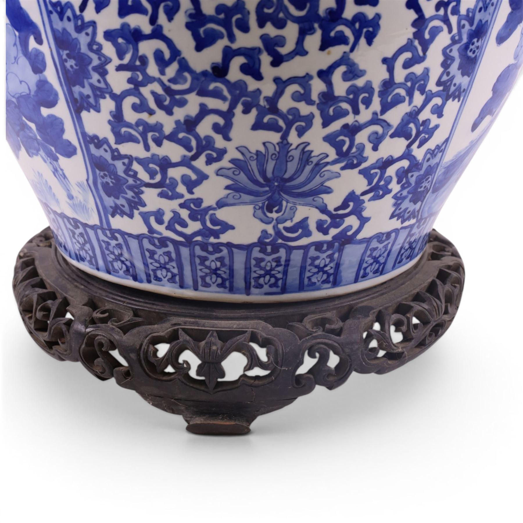 20th century blue and white fishbowl planter, decorated with birds in blossoming branches, internally decorated with goldfish, upon a wooden base, H44cm
