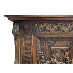 19th century heavily carved oak settle, the moulded upper rail over triangular foliage carved frieze, three Flemish style carved panels depicting tavern scenes, acanthus carved uprights terminating to lion carved arms, hinged box seat, the panelled front carved with lion masks and extending scrolled acanthus leaves, on moulded skirt base