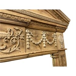 Large Adams design pine frame mirror, sloped broken arch pediment with central acanthus leaf carving, the frieze decorated with bell flower garlands and central kylix vase motif, large plain mirror plate flanked by panelled sides with egg and dart mouldings and reeded slip mouldings, on plinth base