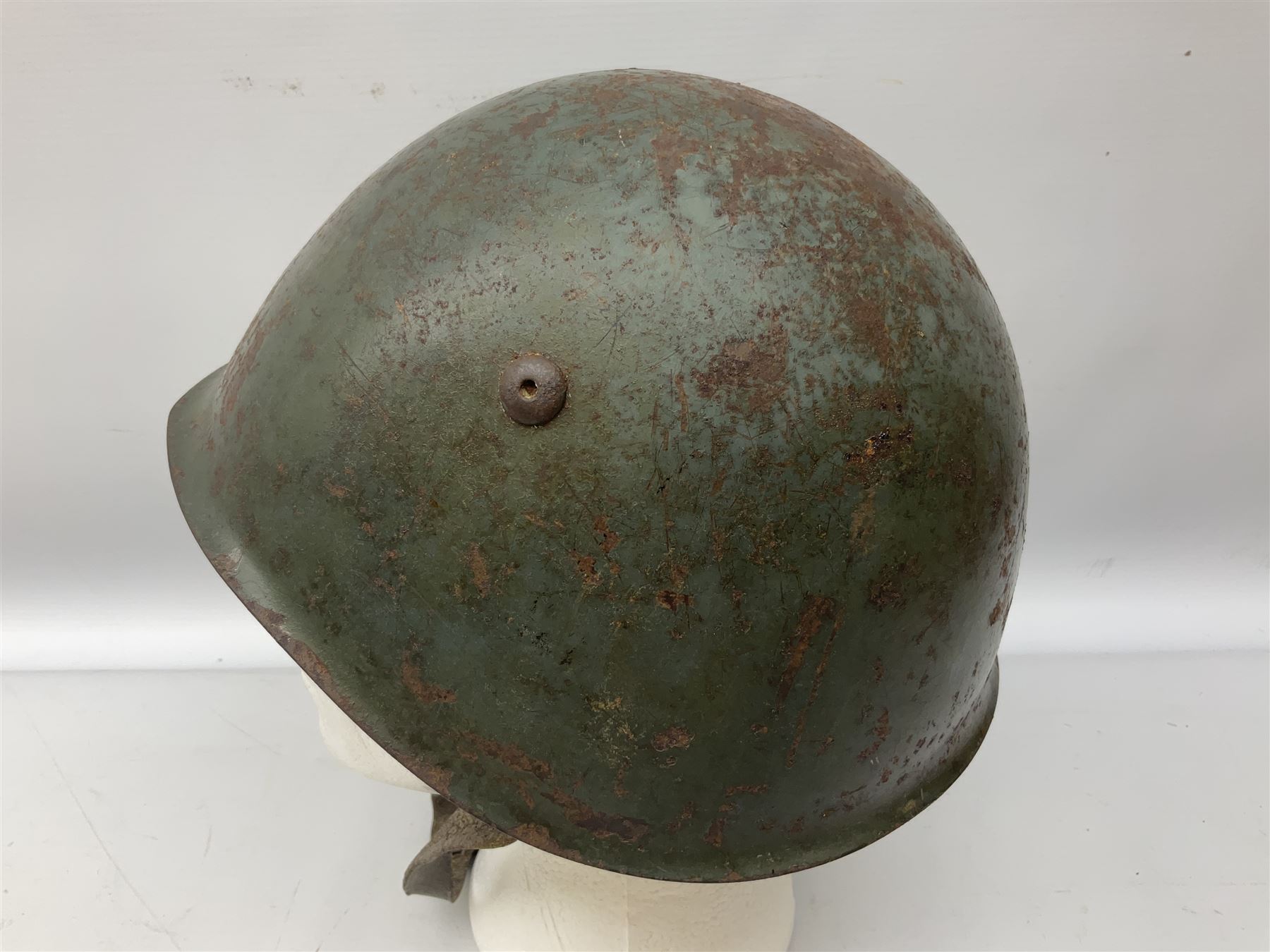 WWII Italian steel helmet with liner and chin strap