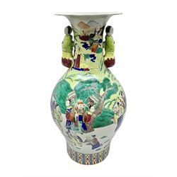 20th century Chinese Famille Rose vase, of baluster form with flared lobed rim and twin figural handles, decorated in polychrome enamel with figures dancing and playing instruments within a garden setting, H42cm