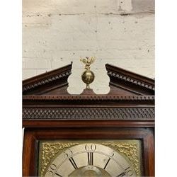 Early 19th century oak and mahogany banded longcase clock, the sloped arch and dentil pediment with central finial above blind fret work frieze, square brass dial with silvered Roman and Arabic chapter ring signed ‘Barker, Wigan’, ornate gilt metal spandrels, subsidiary seconds dial and calendar aperture, dial size - 32.5cm x 32.5cm, shaped arch trunk door flanked by fluted quarter columns, eight day movement striking on bell