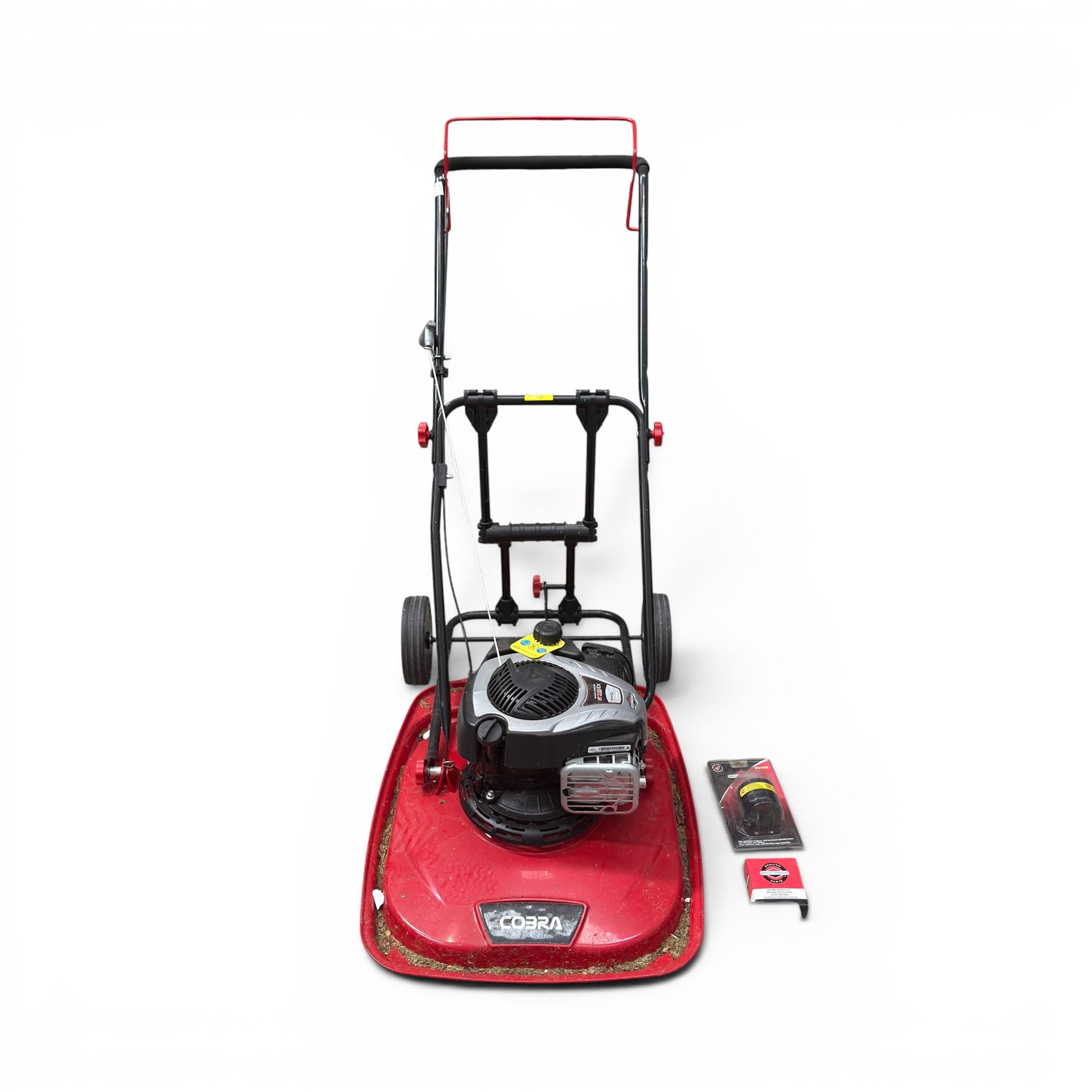 Cobra-  575ex petrol hover mower, with Briggs & Stratton engine, wheeled transport frame and red deck.