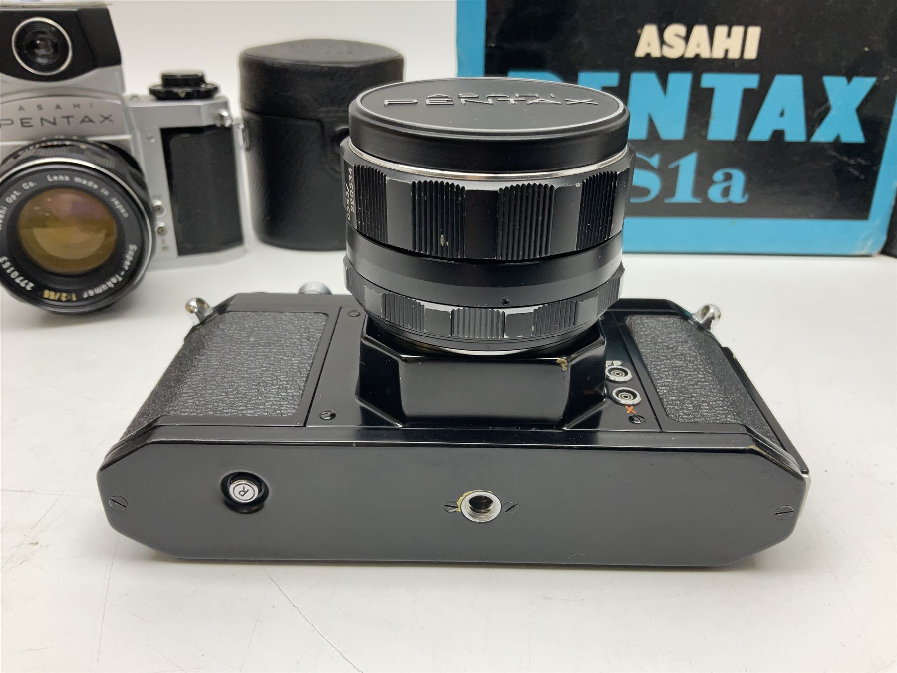 Asahi Pentax S1a camera body, serial no. 707071, with 'Super-Takumar 1:1.8/55' lens, serial no 2124044, together with Asahi Pentax Sv camera body, no. 1925617 with 'Super-Takumar 1:2/55' lens, serial no. 2770153, Asahi Pentax Meter, 'Super-Takumar 1:3.5/28' lens, serial no. 2075492 and 'Super-Takumar 1:4/150' lens, serial no. 1461613  
