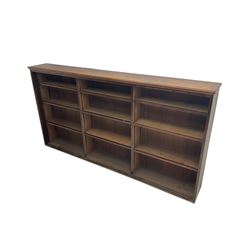 Early to mid-20th century oak bookcase, three sections each with three adjustable shelves