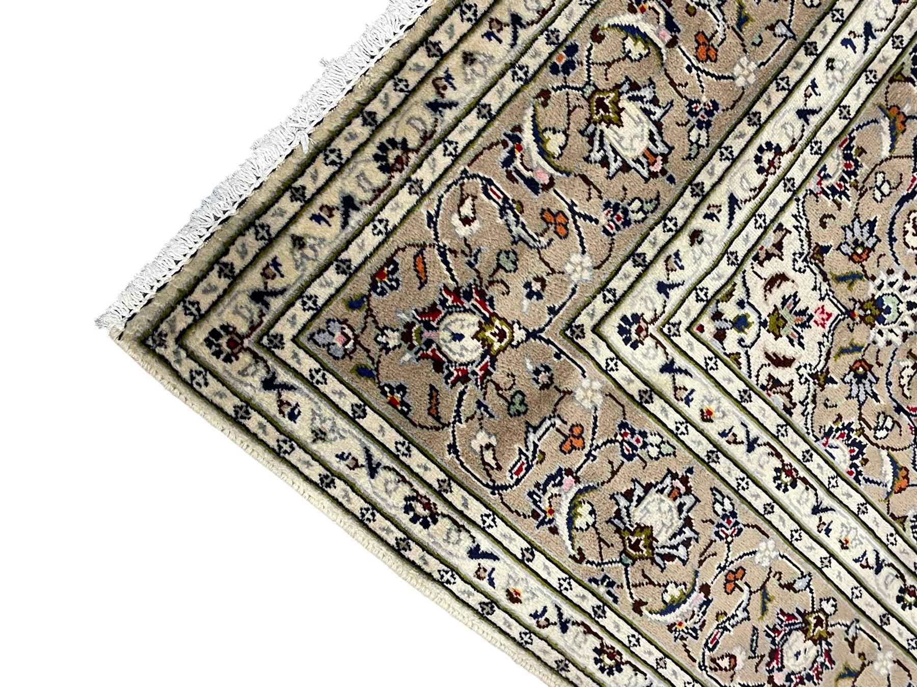 Persian Kashan ivory ground rug, central pointed rosette medallion surrounded by scrolling branches and stylised flower heads, the border with scrolling pattern decorated with palmettes, within guard stripes