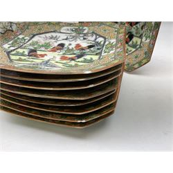 1930's Chinese porcelain dinner service, hand-painted in enamels with Cockerels and birds in a garden setting, comprising eleven dinner plates, eleven tea plates, nine canted square plates, twelve soup bowls, two tureens and covers and a large serving bowl 
