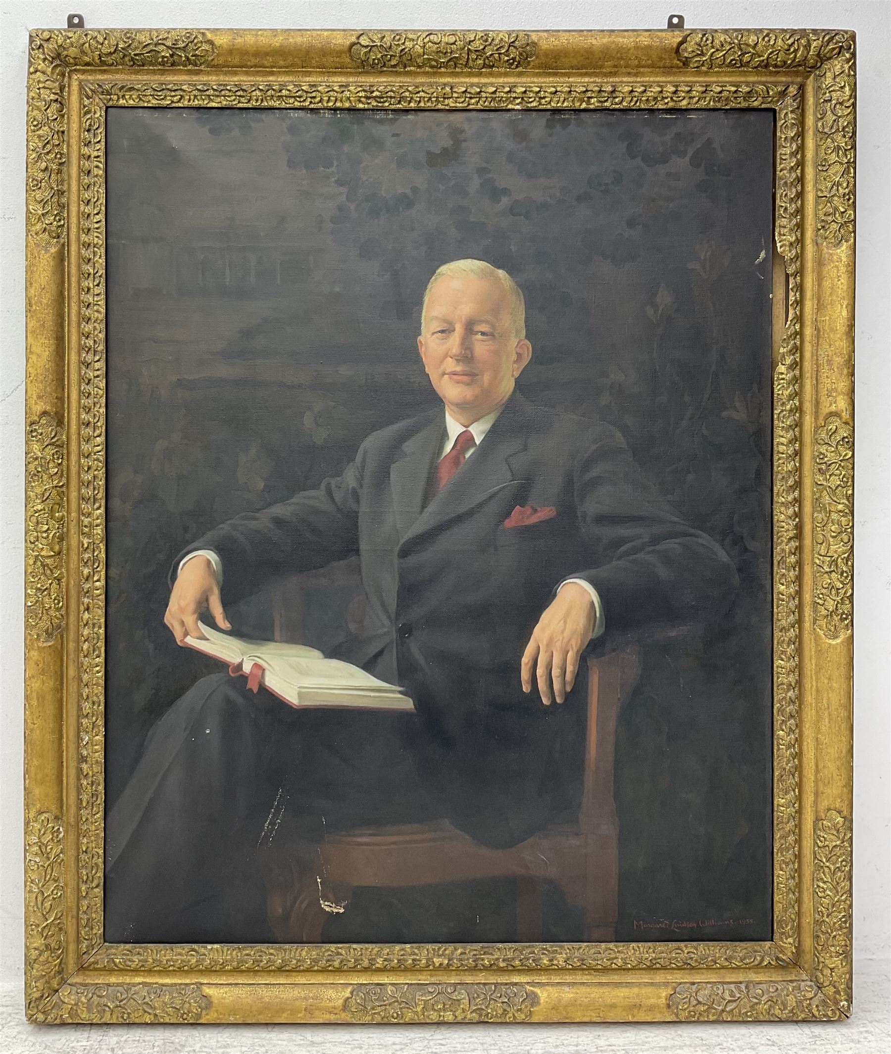 Margaret Lindsay Williams (Welsh 1888-1960): Three-Quarter Length Portrait of a Gentleman Holding a Book, oil on canvas signed and dated 1955, 129cm x 100cm 
Notes: Margaret Lindsay Williams was a notable portrait painter of members of the Royal Family and Politicians.