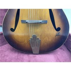 1950s Framus arch top acoustic guitar with sunburst finish and Framus logo to top, No.1937 L104cm; in hard carry case.