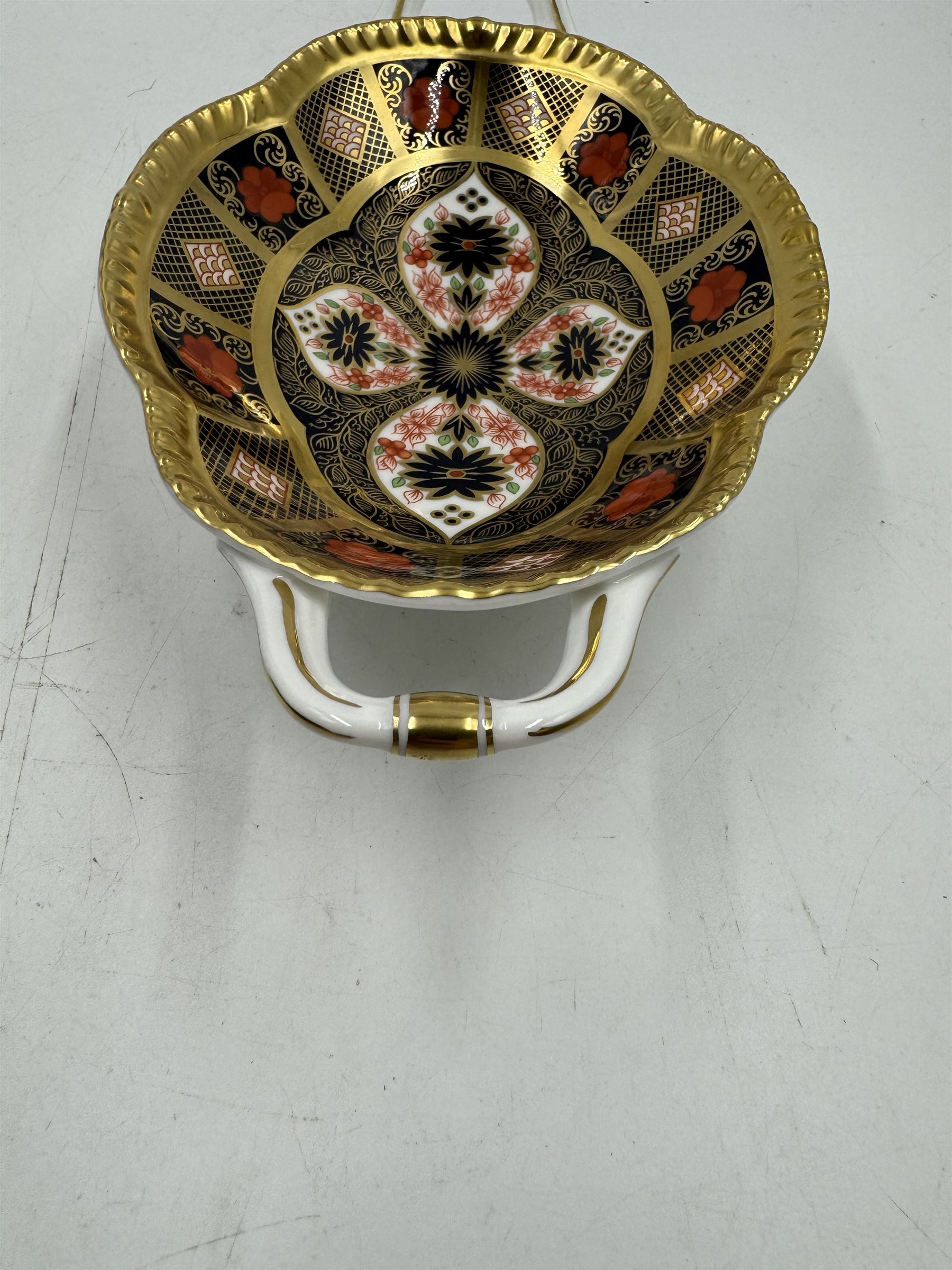 Royal Crown Derby Old Imari pattern 1128 twin handled sweetmeat dish, upon an oval pedestal, with printed mark beneath, H4.5cm, including handles W22.5cm 