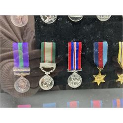 Limited edition large framed display board with sixty half-size copies of British Gallantry and Campaign Medals produced by Danbury Mint; all with ribbons and associated booklet
