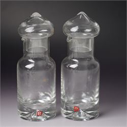 Three Dartington Crystal examples designed by Frank Thrower, comprising two oils and vinegar bottles, and one decanter, together with a covered jar with spoon designed by Palona Picasso for Villeroy & Boch, all boxed (3)