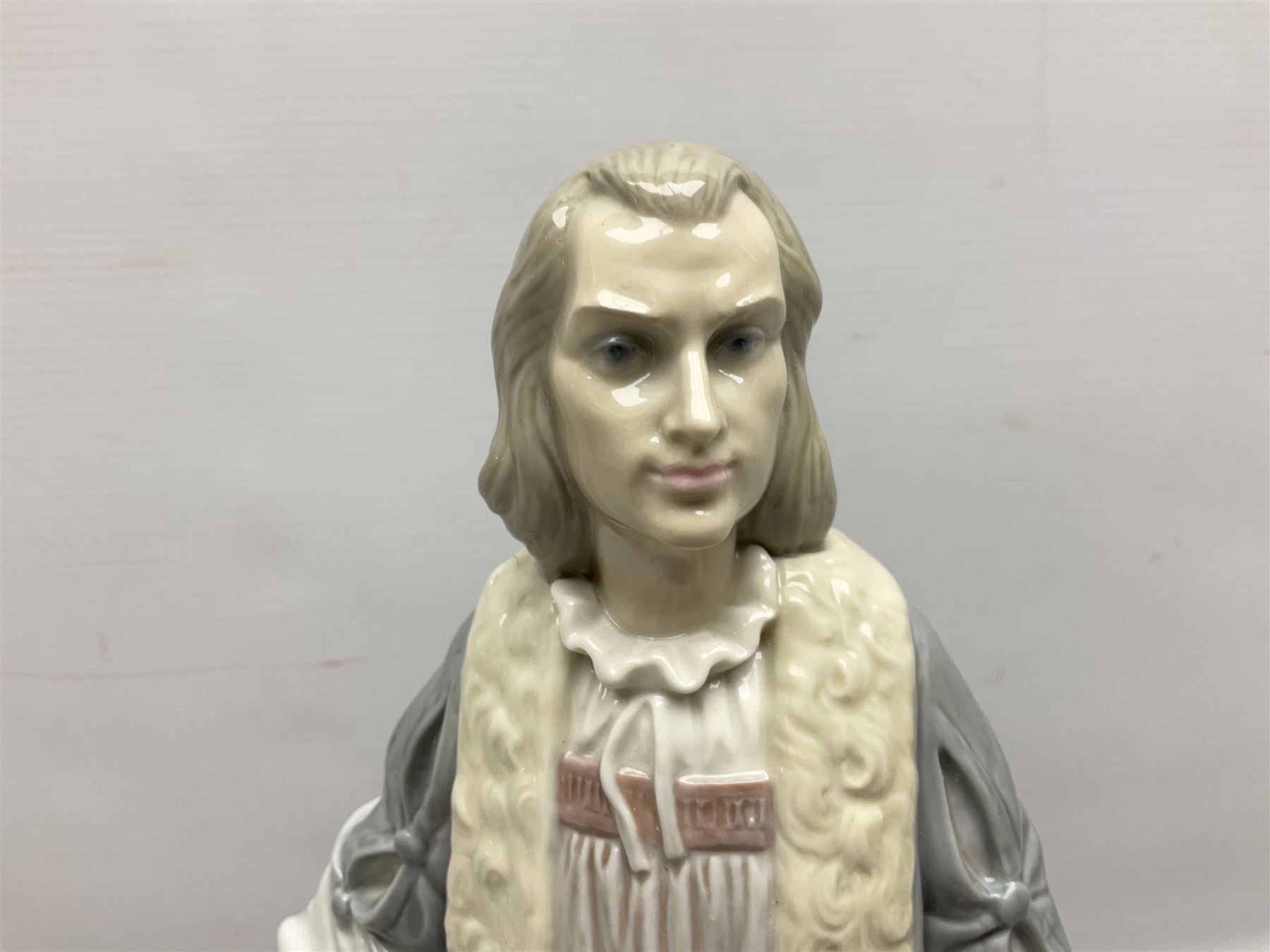 Lladro figure, Columbus, modelled as Christopher Columbus stood by a globe, limited edition 896/1200, no 1432, sculpted by Salvador Furio, with original box, year issued 1982, year retired 1988, H42cm
