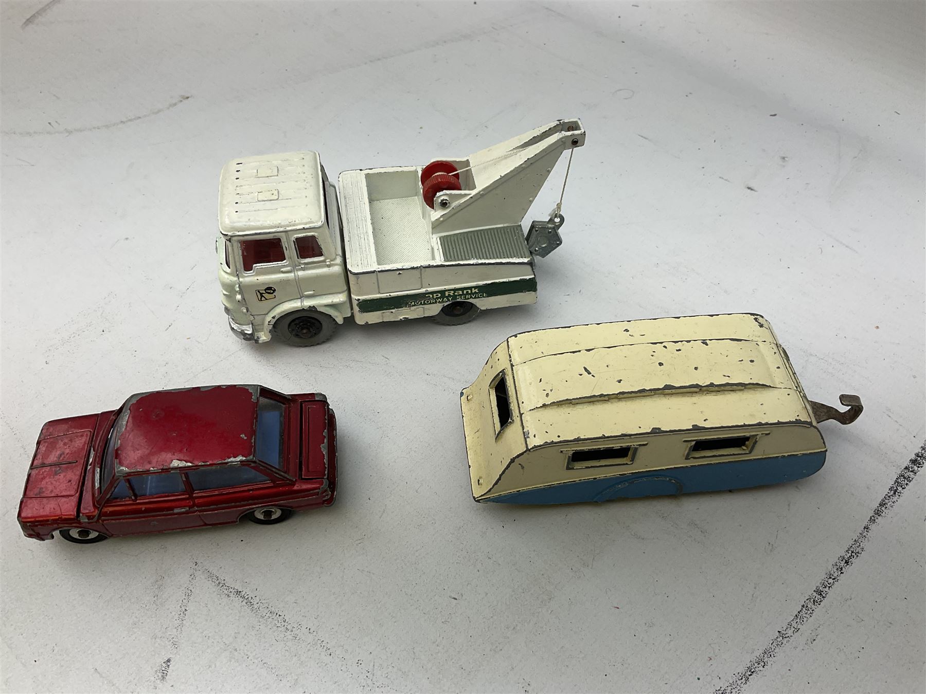 Dinky - twenty-five unboxed and playworn die-cast models including Lady Penelope FAB1, Caravan, Ford Sedan, Triumph TR2, Packard, Austin Somerset, Devon, Healey and Seven Countryman etc (25)