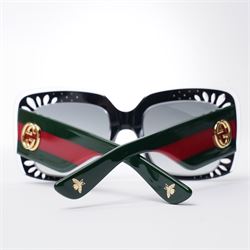 Gucci - pair of oversized black acetate sunglasses, the square frames with studded and crystal embellishment to the front and signature green and red web temples with interlocking gold-tone GG logo and bee motif, unused with original velvet pouch and box