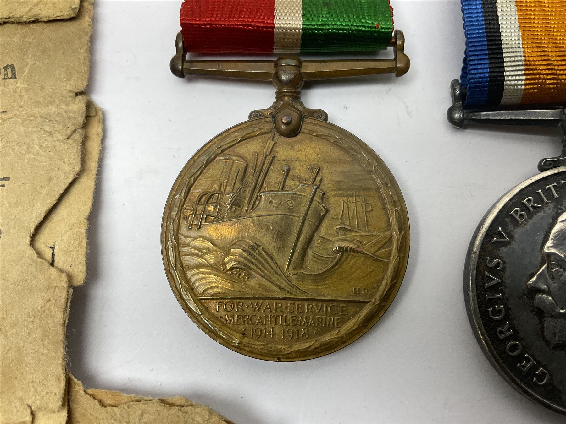 WWI pair of medals comprising Mercantile Marine medal and British War medal, awarded to Dominic L Kelly; both with ribbons and part original packaging and a Victoria Diamond Jubilee medallion.