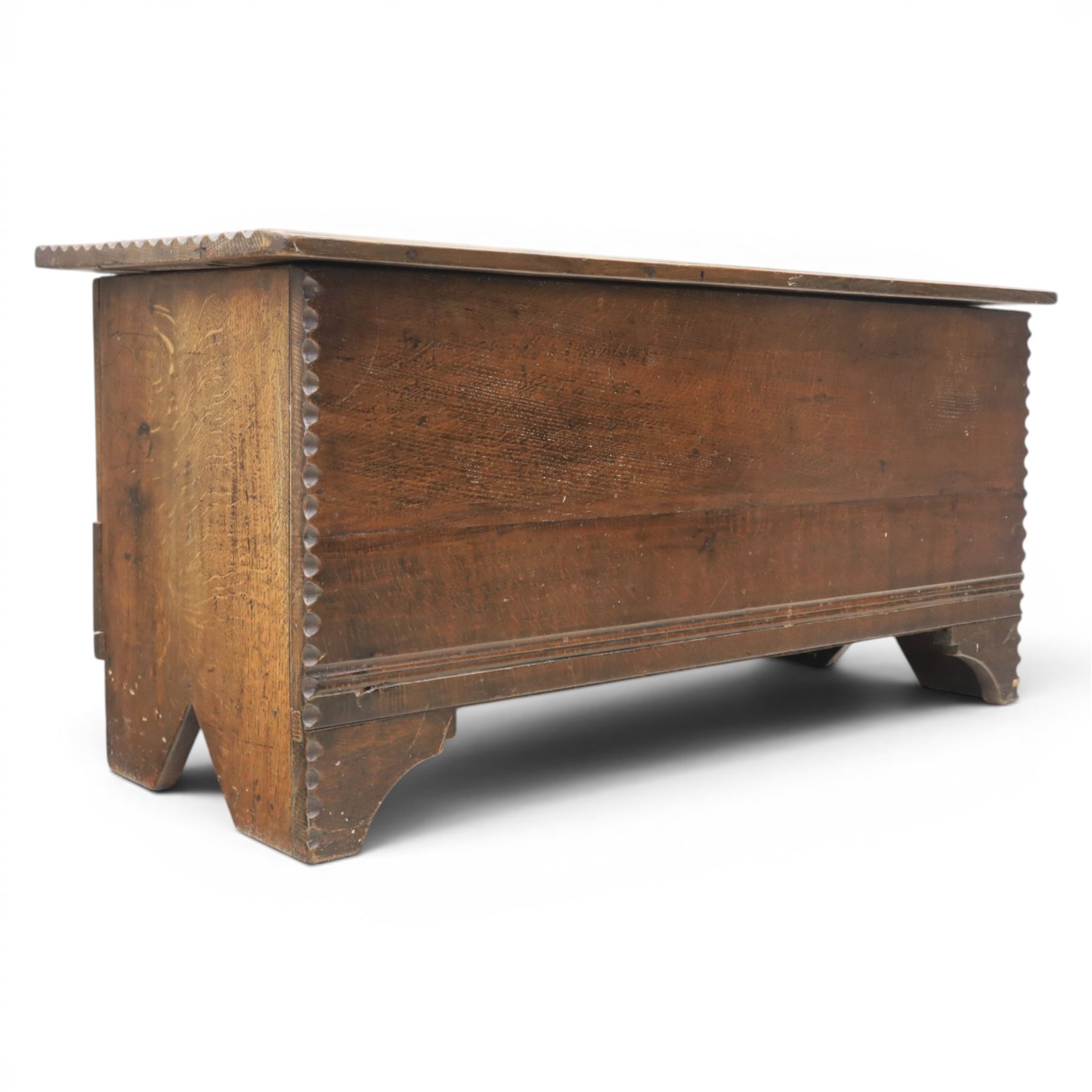19th century oak boarded blanket box, with chip-carved edges, raised on shaped cut away bracket supports