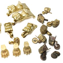 Set of four period design lacquered brass paw furniture castors by Beardmore, London, set of four matching smaller castors and a quantity of various brass castors   
Provenance: property of a Nobleman