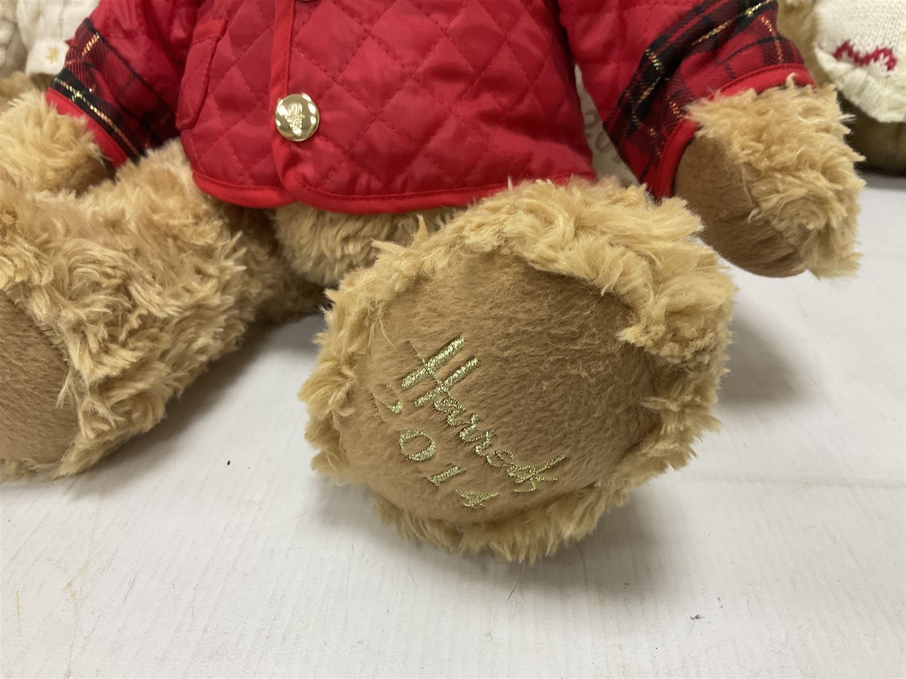 Six Harrods annual teddy bears, dating between 2011 and 2016, tallest H38cm