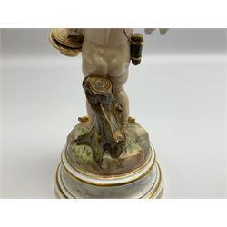 Late 19th/early 20th century Meissen figure of cupid, modelled standing with empty quiver across back, holding a basket in one arm, the other raised to head, upon a naturalistically modelled base detailed with gilt bow,  and marble effect socle base with gilt bands, with blue crossed swords mark beneath, H18.5cm