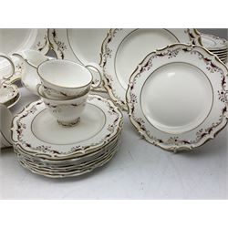 Royal Doulton dinner service for nine, decorated in the 'Strasbourg' pattern,  comprising dinner plates, rimmed soup bowls, smaller bowls, cups, saucers, tea plates, dinner plates and coffee plates, oval platter and two sauce boats with saucers