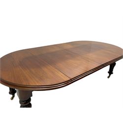 Victorian mahogany extending dining table, circular telescopic extending top with moulded edge, two additional leaves, on turned and lobe carved supports with brass and ceramic castors 